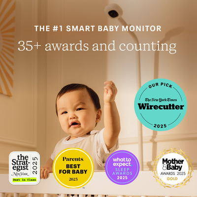 Nanit Smart Baby Pro Monitor with floor stand in a nursery, showing the sleek monitor screen and adjustable stand for baby monitoring.